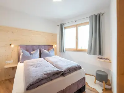 Ein Bett oder Betten in einem Zimmer der Unterkunft Haus Heimat - Enzian