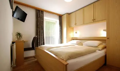 Ein Bett oder Betten in einem Zimmer der Unterkunft Appartement Daniel - inkl JOKER CARD