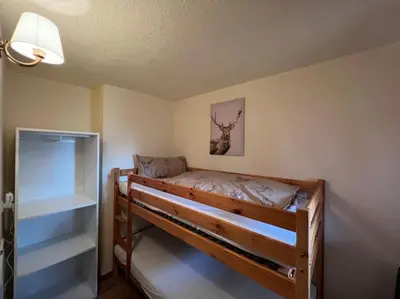 Ein Bett oder Betten in einem Zimmer der Unterkunft Ferienwohnung Steinbock Terrasse, Gartensauna, Garten, Grillplatz