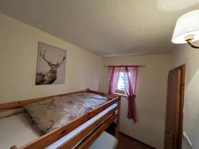 Ein Bett oder Betten in einem Zimmer der Unterkunft Ferienwohnung Steinbock Terrasse, Gartensauna, Garten, Grillplatz