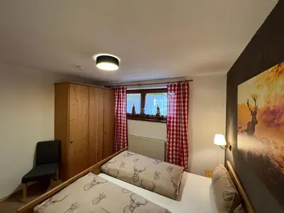 Ein Bett oder Betten in einem Zimmer der Unterkunft Ferienwohnung Steinbock Terrasse, Gartensauna, Garten, Grillplatz