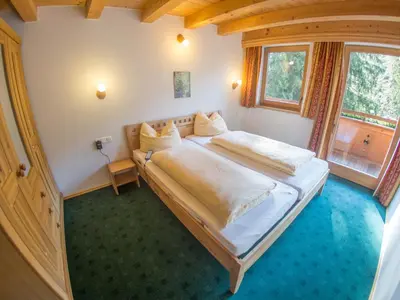 Ein Bett oder Betten in einem Zimmer der Unterkunft Appartementhaus Wildbachhof