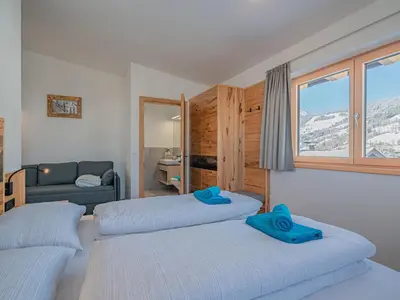 Ein Bett oder Betten in einem Zimmer der Unterkunft Penthouse Brixental with swimming pond