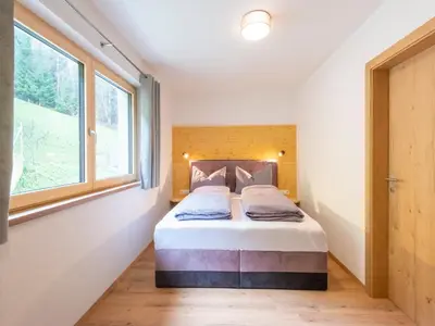 Ein Bett oder Betten in einem Zimmer der Unterkunft Haus Heimat - Alpenrose