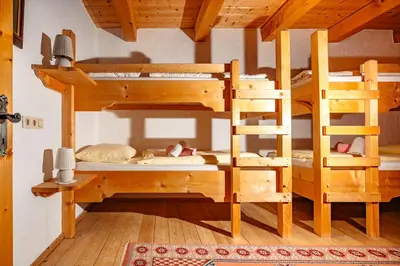 Ein Bett oder Betten in einem Zimmer der Unterkunft Magdalena Hütte
