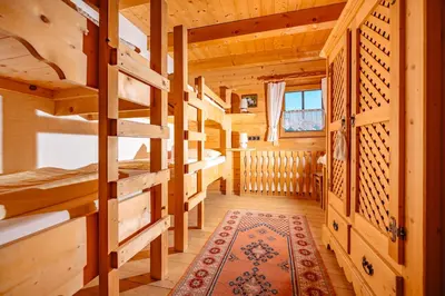 Ein Bett oder Betten in einem Zimmer der Unterkunft Magdalena Hütte