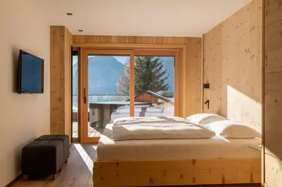 Ein Bett oder Betten in einem Zimmer der Unterkunft Chalet Residenz Zillertal Mühlermoos