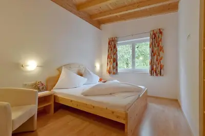 Ein Bett oder Betten in einem Zimmer der Unterkunft Wildauhof