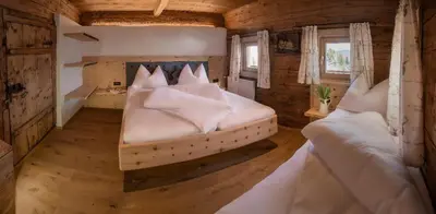Ein Bett oder Betten in einem Zimmer der Unterkunft Wildauhof - Alm