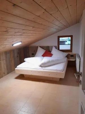 Ein Bett oder Betten in einem Zimmer der Unterkunft Wildauhof - Bauernhaus