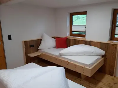 Ein Bett oder Betten in einem Zimmer der Unterkunft Wildauhof - Bauernhaus
