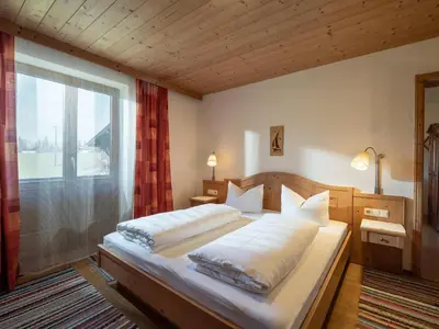 Ein Bett oder Betten in einem Zimmer der Unterkunft Im Riederhof
