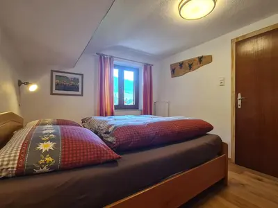Ein Bett oder Betten in einem Zimmer der Unterkunft Im Riederhof