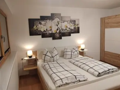 Ein Bett oder Betten in einem Zimmer der Unterkunft Ferienwohnung Oberkreut