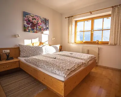 Ein Bett oder Betten in einem Zimmer der Unterkunft Chalet Obenland Kitzbühler Alpen