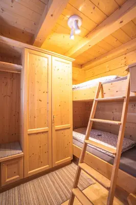Ein Bett oder Betten in einem Zimmer der Unterkunft Chalet Obenland Kitzbühler Alpen