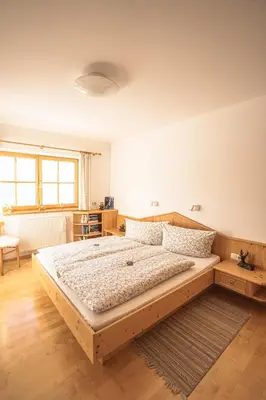 Ein Bett oder Betten in einem Zimmer der Unterkunft Chalet Obenland Kitzbühler Alpen