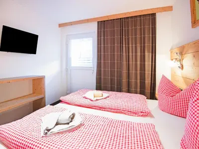 Ein Bett oder Betten in einem Zimmer der Unterkunft Chalet in Fügen near Spieljoch Ski Lift