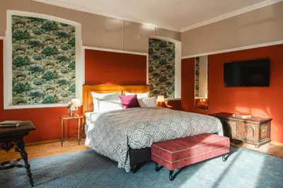Ein Bett oder Betten in einem Zimmer der Unterkunft HENRI Hotel Kitzbühel