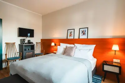 Ein Bett oder Betten in einem Zimmer der Unterkunft HENRI Hotel Kitzbühel