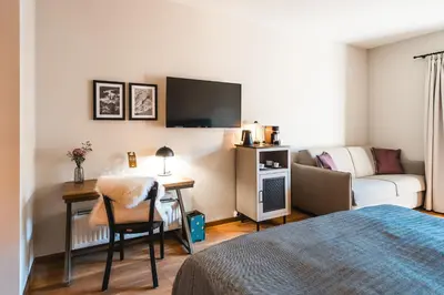 Ein Bett oder Betten in einem Zimmer der Unterkunft HENRI Hotel Kitzbühel