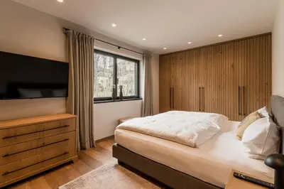 Ein Bett oder Betten in einem Zimmer der Unterkunft Genießen Sie Bergblick & Sauna im modernen Chalet