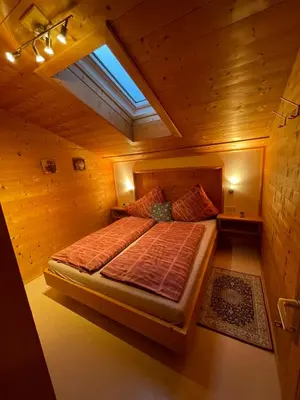 Ein Bett oder Betten in einem Zimmer der Unterkunft Alpapart Schneider