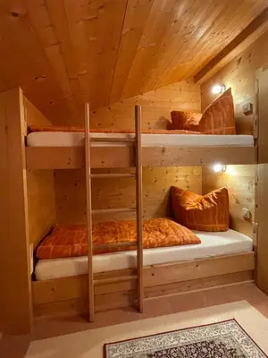 Ein Bett oder Betten in einem Zimmer der Unterkunft Alpapart Schneider